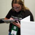 Haley Britt of Lincoln County uses an iPad instead of a paper ballot on May 28, 2014 to vote for State 4-H Council officers during the annual 4-H Club Congress at Mississippi State University. (Photo by MSU Ag Communications/Libby Durst)
