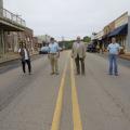 Four people stand on Main Street in Saltillo, MS.