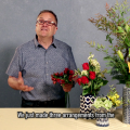 A man shows how to supplement supermarket floral bouquets with landscape materials.