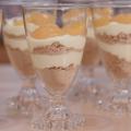 Clear glass parfait cups with lemon pudding layered with graham cracker crumbs topped with manadarin orange slices
