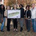 Members of The Marks Project in Quitman County hold a rendering of an improved community.