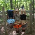 Imitating bats that like to hang upside down is a fun activity for children as they explore a nature trail at St. Catherine Creek National Wildlife Refuge near Natchez, Mississippi, on July 7, 2016. (Photo by MSU Extension Service/Linda Breazeale)