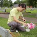 Gail Moraru, a research associate with the Mississippi State University Extension Service, collects mosquito larvae in water from a vase in Odd Fellows Cemetery in Starkville, Mississippi, on Aug. 10, 2016. Moraru and others workers with MSU Extension are collecting samples in 41 north Mississippi counties in an effort to pinpoint potential Zika-affected areas. (Photo by MSU Extension Service/Kat Lawrence)
