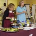 Angie Crawford, left, and Mari Alyce Earnest of the Mississippi State University Extension Service office in Quitman County deliver a nutrition education program Sept. 13, 2016, at the community center in Lambert, Mississippi. Extension works with several area organizations to provide food for about 800 underserved families every other month. (Photo by MSU Extension Service/Kevin Hudson)