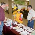 Monroe County Extension agent Randall Nevins, left, reviews horticulture career options with Karen Carothers and Elsie Buskes, both of Oxford, Mississippi. Dennis Reginelli, right, a regional specialist with the Mississippi State University Extension Service, joins the discussion at a career expo for eighth-graders in Tupelo, Mississippi, on Oct. 5, 2016. (Photo by MSU Extension Service/Linda Breazeale)
