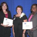 National Extension Association for Family and Consumer Sciences past president Kathleen Ann Olson, center, presents Jenna Schilling, left, and Natasha Haynes with the Early Childhood Child Care Training Award for the TummySafe program at the NEAFCS Annual Conference in Lexington, Kentucky on Sept. 18, 2014. (Submitted Photo)