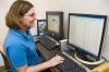 Fiona McCarthy, a biocuration specialist with the Mississippi State University College of Veterinary Medicine, examines protein expression data that may indicate how the immune system develops in chickens. (Photo by Tom Thompson)