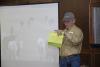 Ray Welch, owner of Winona Stockyards, serves as the auctioneer for the Cattlemen's Exchange and Homeplace Producer Sale held in April. Buyers see video segments and read descriptions of cattle lots as they bid on the animals. More than 2,000 cattle were sold in less than an hour with total receipts approaching $1.9 million. (Photo by Linda Breazeale)