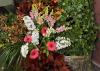 Floral designs, such as this display by Lynnette McDougald of The University Florist, can combine potted plants, collected materials and cut flowers to create wedding d&eacute;cor that is reusable and environmentally friendly. (Photo by Scott Corey)