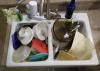 Leaving dirty dishes in the sink provides a feast for pests. Integrated pest management emphasizes practical, cost-efficient strategies for keeping rodents and insects out of the home. (Photo by MSU Extension Service/Kevin Hudson)