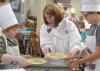 Laura Brumbaugh (center), Mississippi State University Extension Service agent in Tate County, helps Harlan Tagert, left, and Walt Giesen, both of Starkville, finish their quiches on June 21, 2016, at the MSU Fun with Food Camp. The annual summer camp offers hands-on training and educational field trips for 3rd- to 6th-grade children to learn about nutrition, cooking and food safety. (Photo by MSU Extension Service/Michaela Parker) 