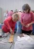 Starkville resident Kathy Elmore, left, cuts a hole into a rootstock during a fruit-grafting workshop on March 26, 2015, at the Northeast Mississippi Research and Extension Center in Verona as Donna Miller of Starkville looks on. (Photo by MSU Ag Communications/Nathan Gregory)