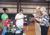 Oktibbeha County 4-H member Trukyra Lawrence, left, waits as judges, from left, Theresa Sproles, Edwin Taylor and Lanelle Martin evaluate her grilling area at the 2016 North Half State Cook-Off competition on June 28, 2016. (File photo by MSU Extension Service/ Kat Lawrence) 