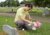 Gail Moraru, a research associate with the Mississippi State University Extension Service, collects mosquito larvae in water from a vase in Odd Fellows Cemetery in Starkville, Mississippi, on Aug. 10, 2016. Moraru and others workers with MSU Extension are collecting samples in 41 north Mississippi counties in an effort to pinpoint potential Zika-affected areas. (Photo by MSU Extension Service/Kat Lawrence)