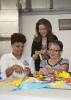 Xenia Wickline, center, is a Biloxi community advocate who works with Kim Gowdy, left, to deliver educational sessions to women in the Mujeres Unidas (Women United) program. Rosa Bender has participated in the program for more than a year. (Photo by MSU Extension Service/Kat Lawrence)