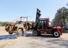 A staff member from Taylor Machine Works lifts a 1948 log loader to transport it to the company's Louisville, Miss., headquarters for restoration.  (File Photo by MSU Forest Operations/Misty Booth)