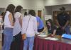 Mississippi 4-H members gathered at Mississippi State University Tuesday, July 15, 2014, for the four-day workshop and tour to learn about business cooperatives and state government. Marella Failla of Hancock County, the state 4-H Council president, helped with registration. (Photo by MSU Ag Communications/Kevin Hudson)