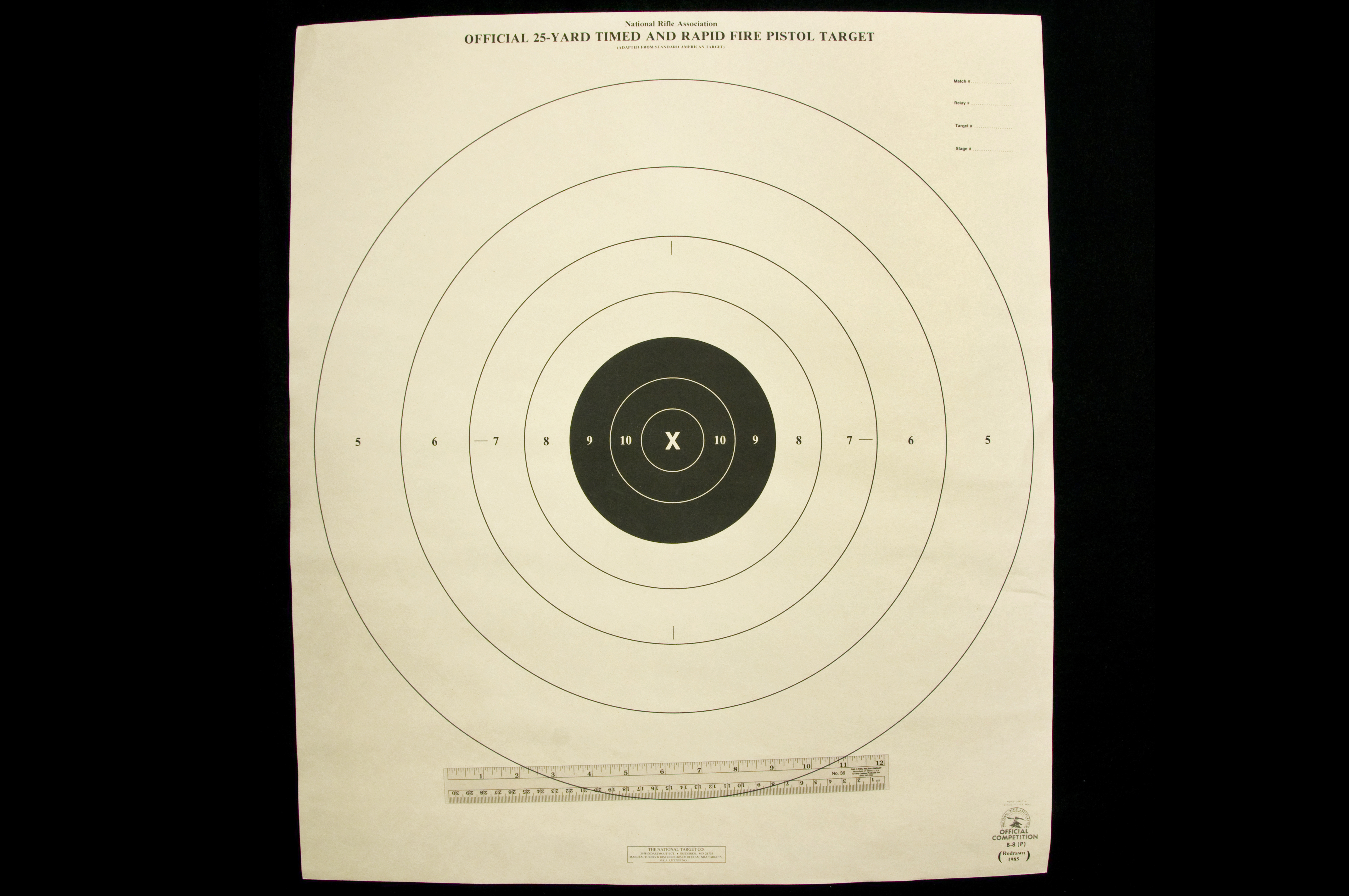 Official 23-Yard Timed and Rapid Fire Pistol Target with four white outer circles and three smaller inner black circles.