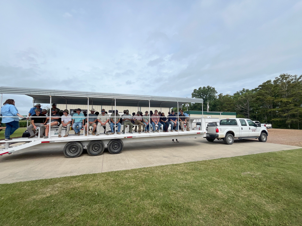 A group of people fill a wagon.