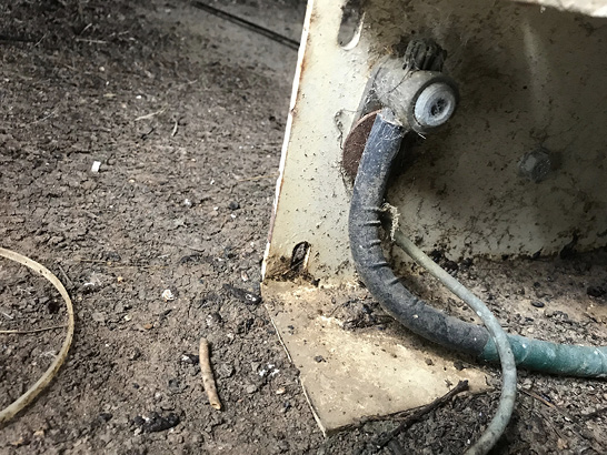 One large and one small ground wire attached to an angle iron generator frame.