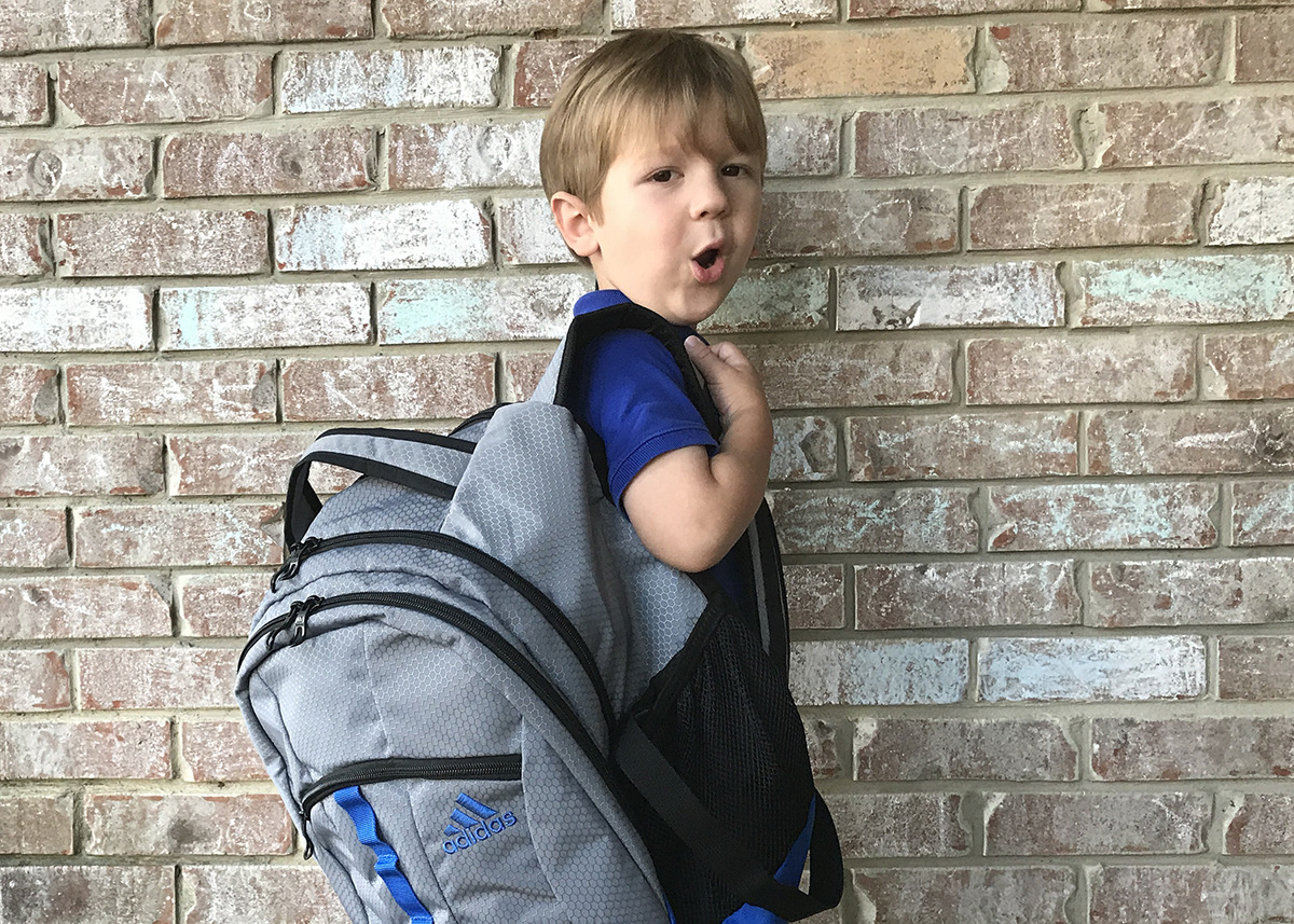 toddler wearing backpack