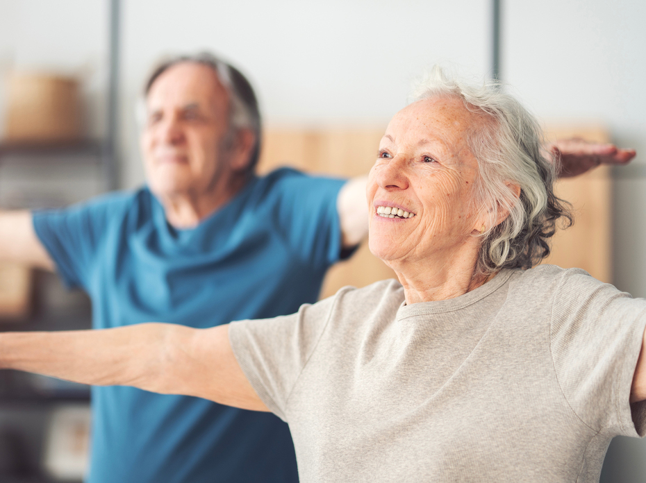 Photo of two people exercising.