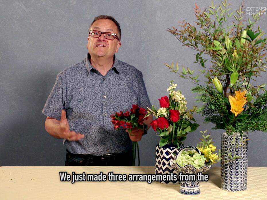 A man shows how to supplement supermarket floral bouquets with landscape materials.