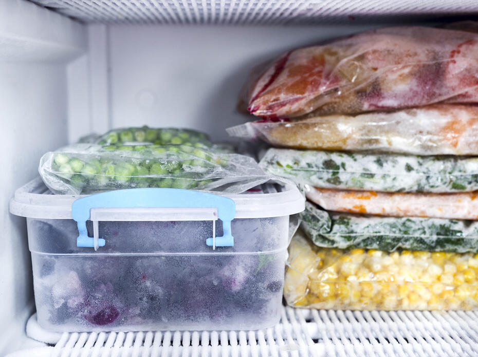 Frozen foods sit in the freezer.