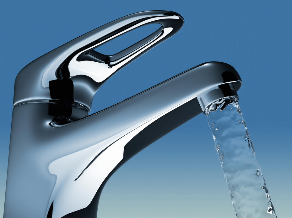 A faucet with water flowing.