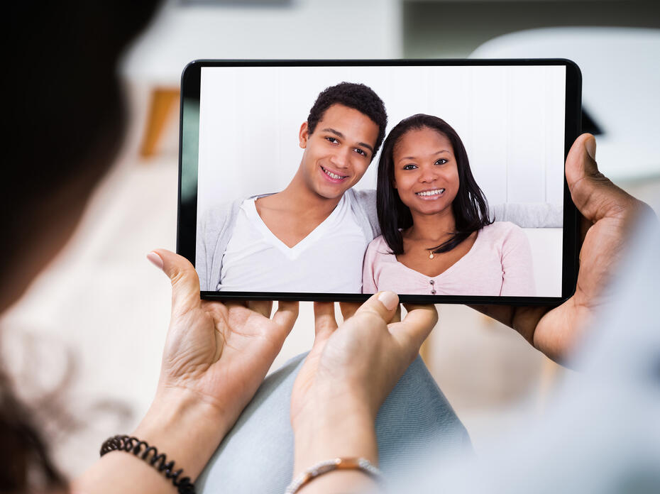 Young couple using digital tablet together