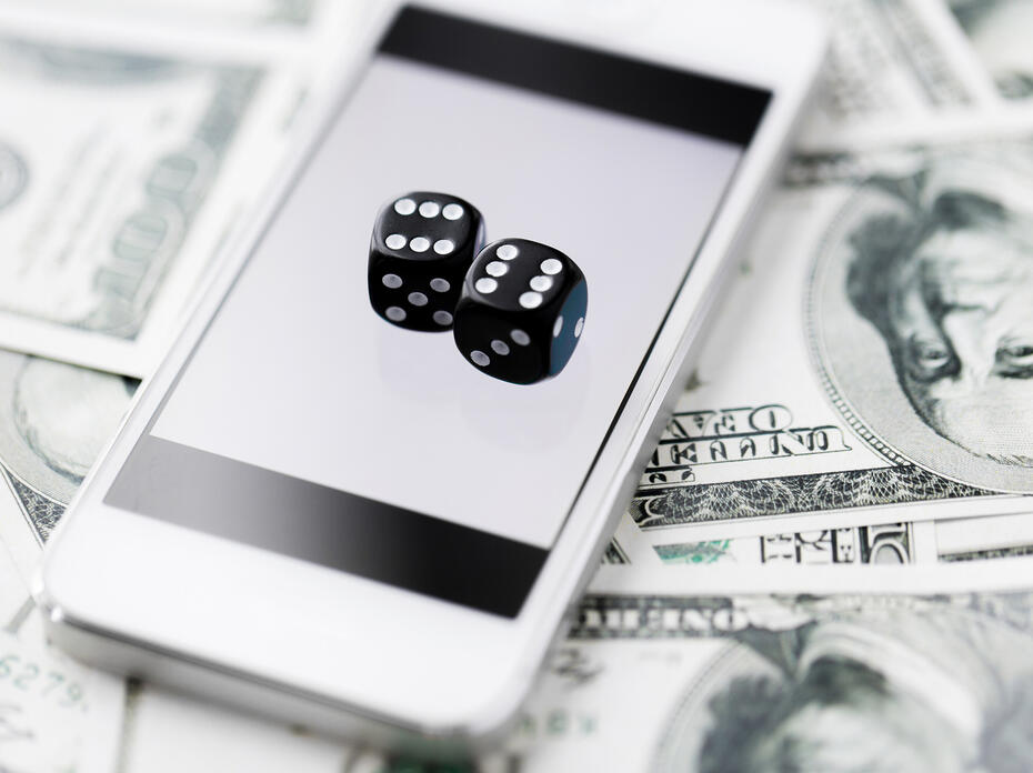 A phone screen displays an image of two dice.