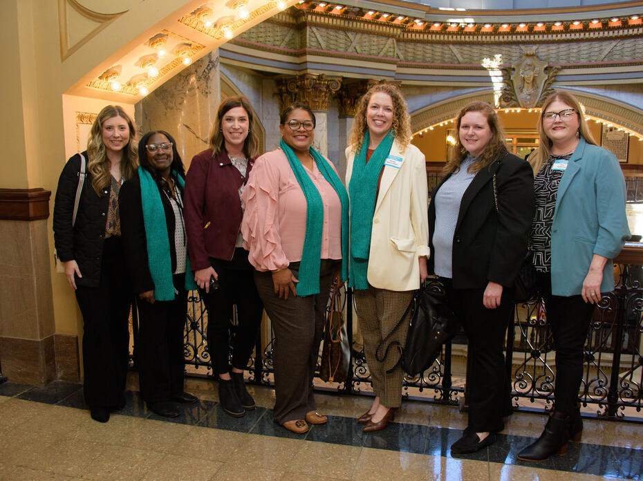 Seven women stand in the Mississippi State Capitol building.
