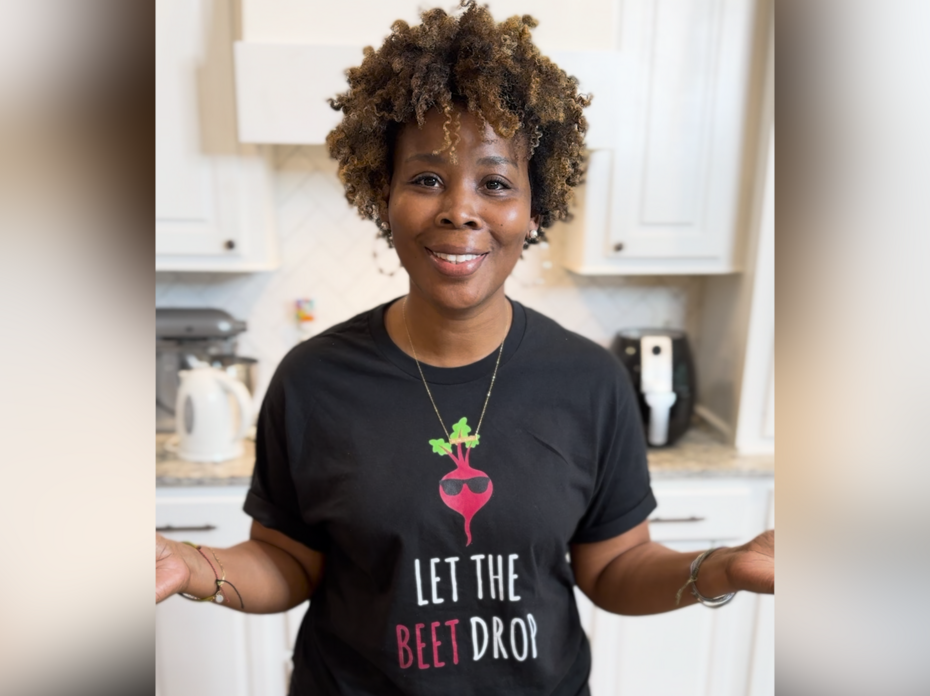 A woman stands in a kitchen