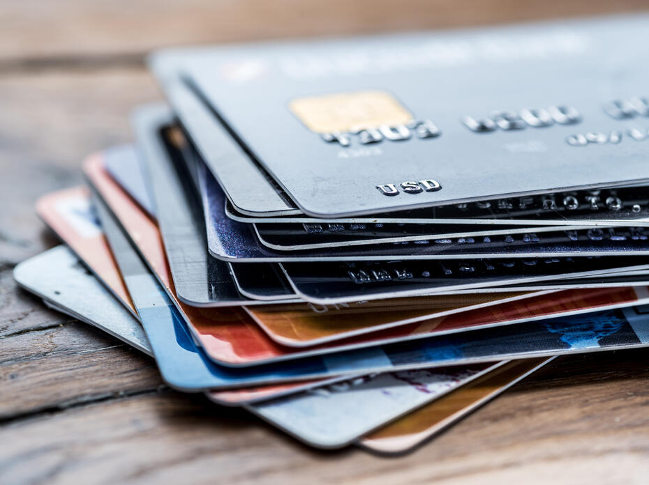 Credit cards laying on a table.