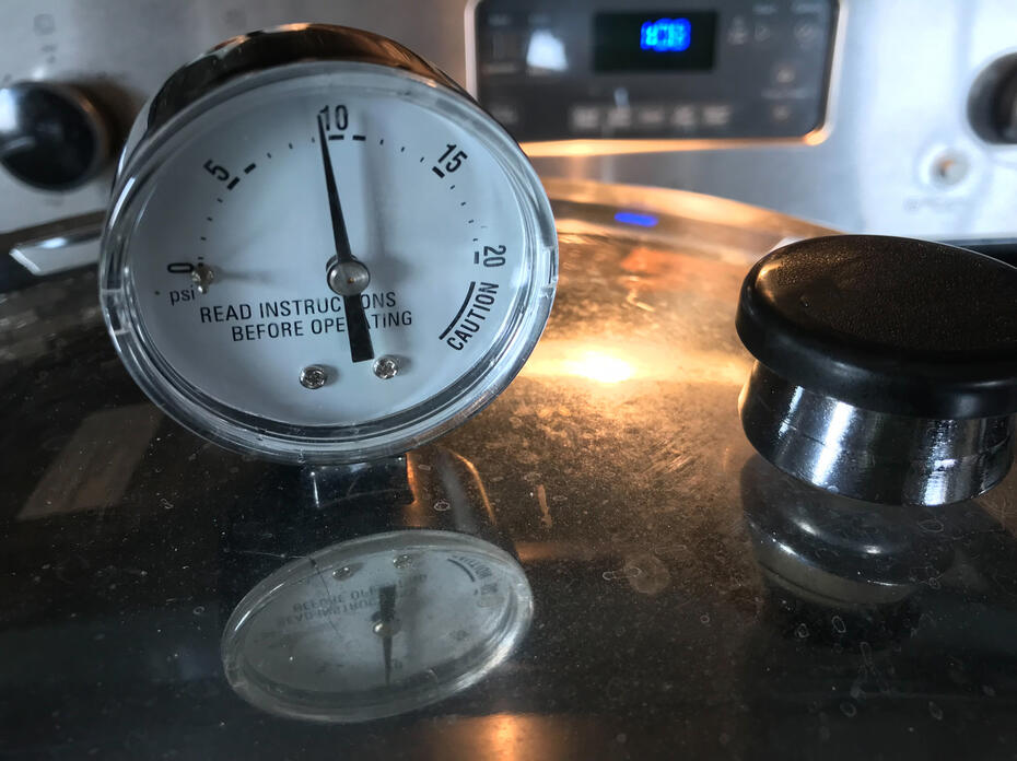 Closeup of a dial on a pressure canner.