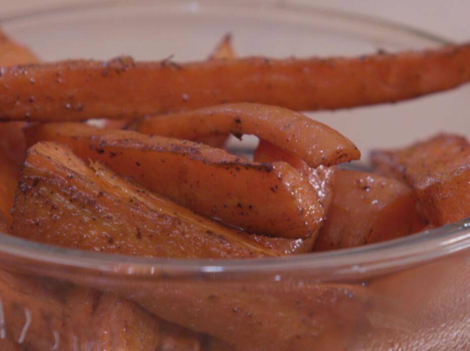 Oven-roasted carrots in a clear glass bowl