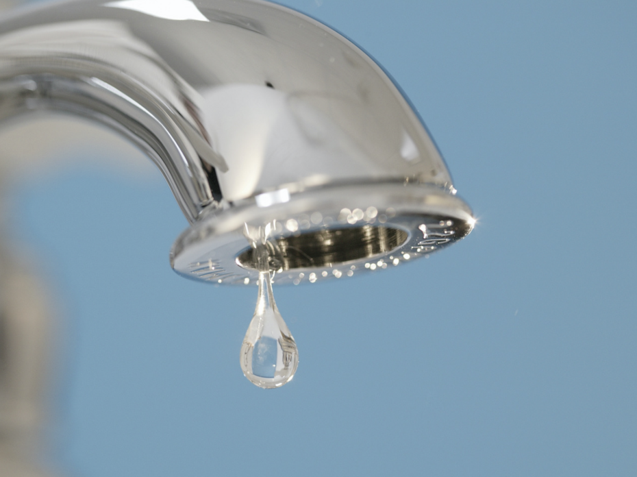 A faucet drips water.
