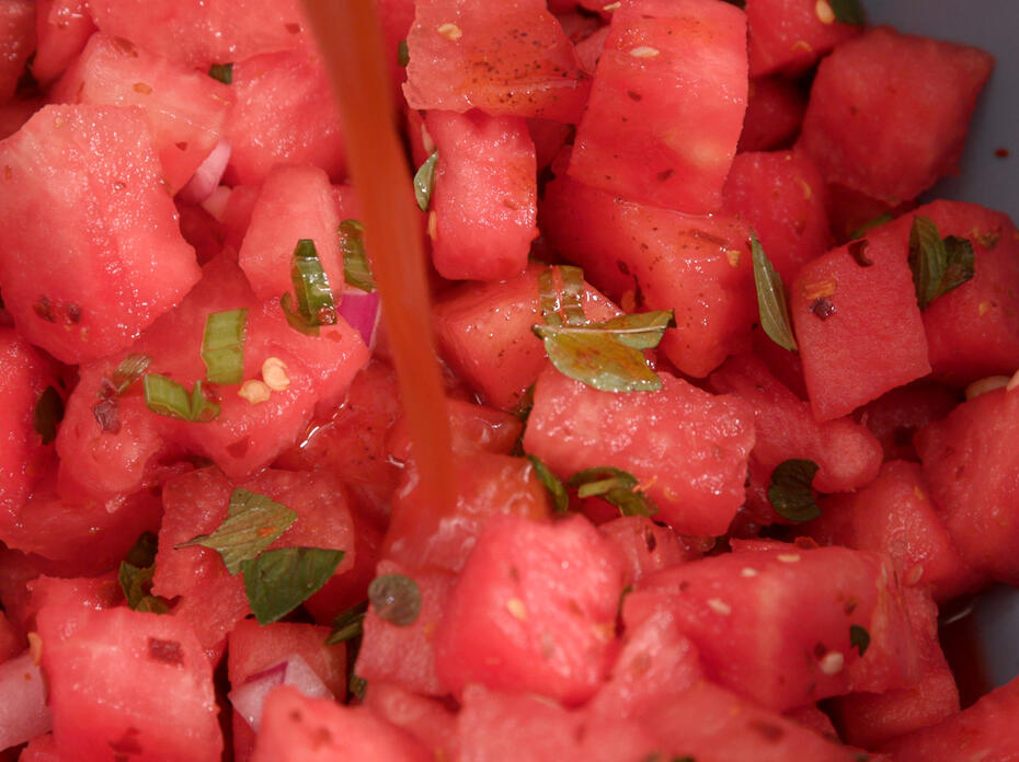 Cubed watermelon with spices and fresh mint.
