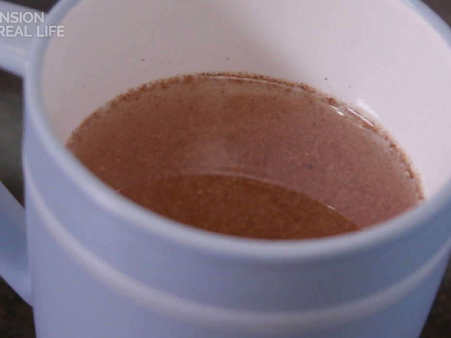 A mug with tea in it.