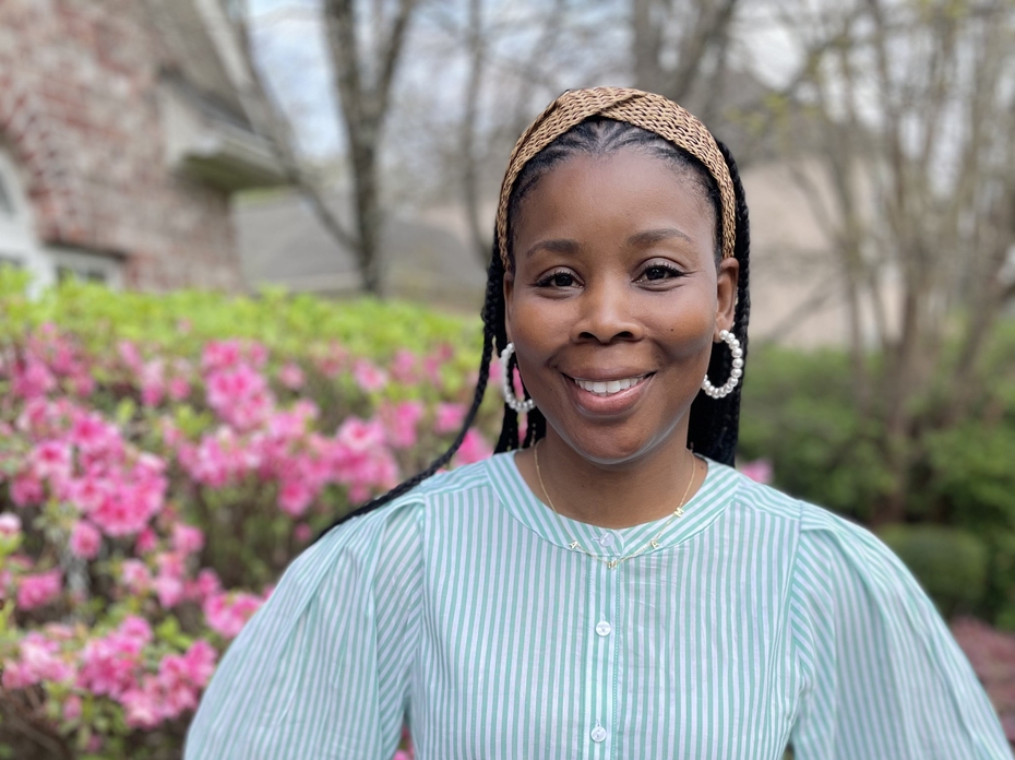 A woman stands outside