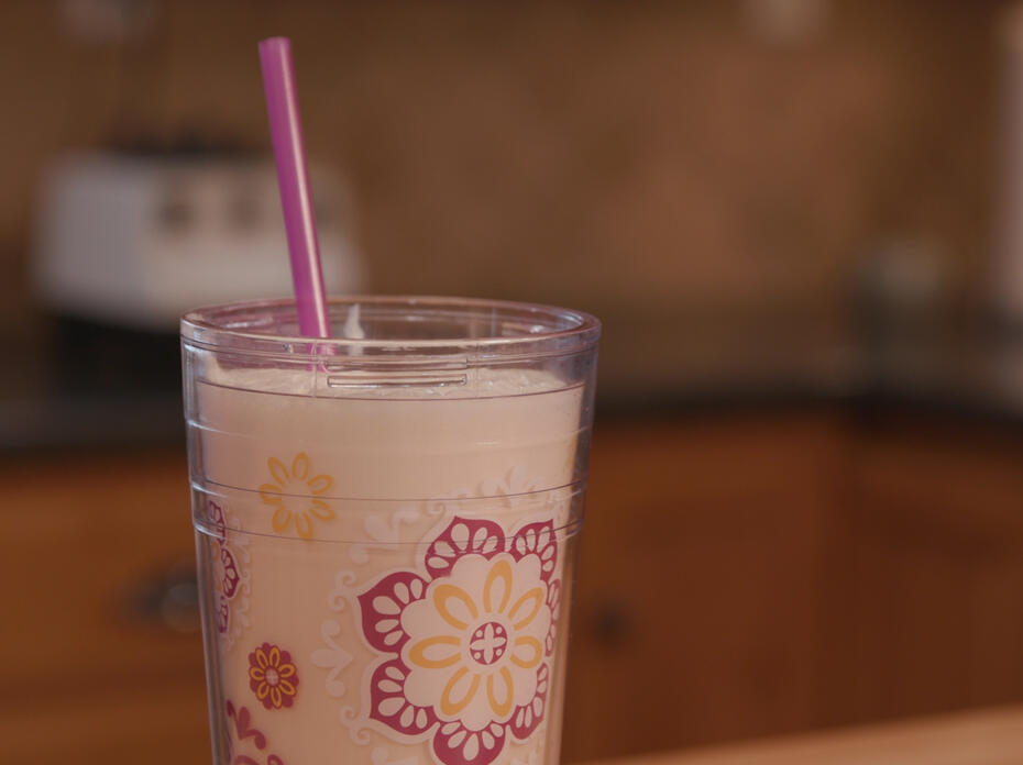 A cup of Orange Delight sits on a counter.