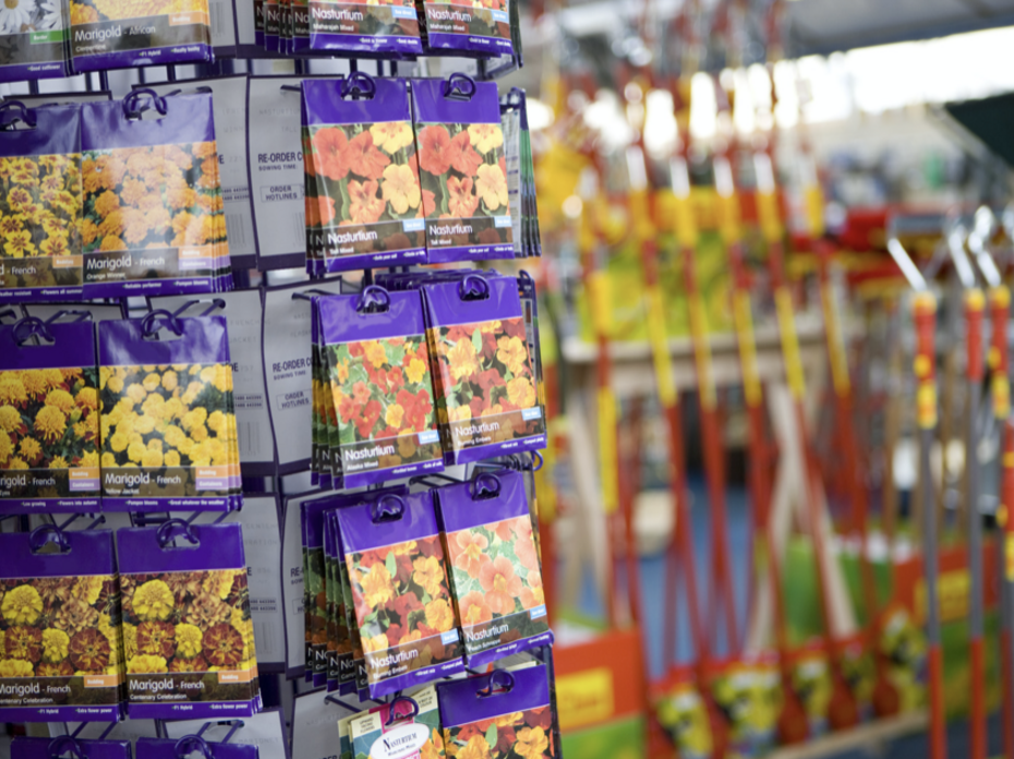 Seed packets on a display in a garden store. 