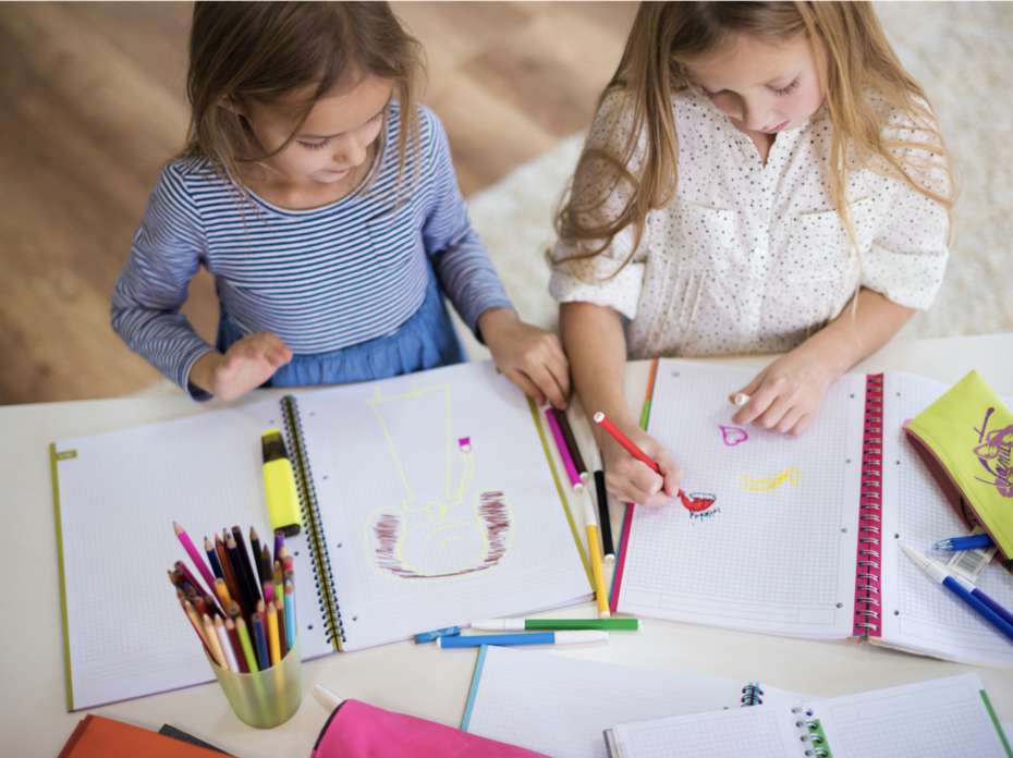 Two girls coloring. 