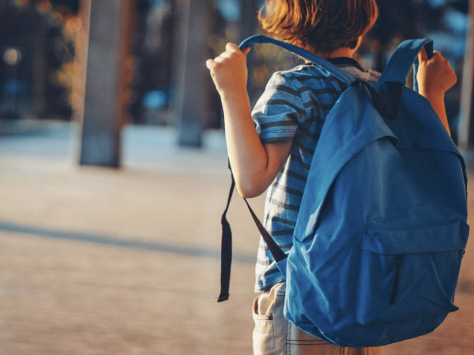 Boy with blue backpack.
