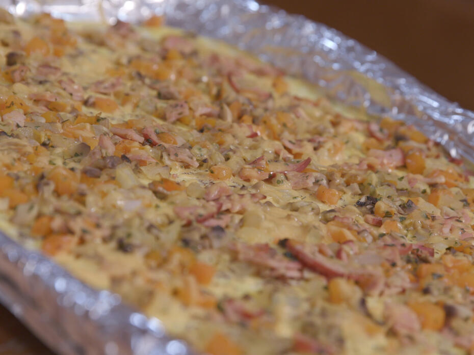 Omelet ingredients cooked on a foil-covered sheet pan