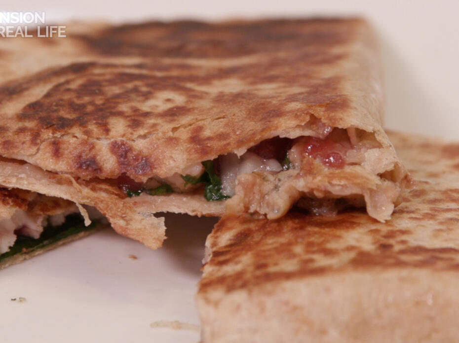 Close up of a sliced quesadilla.