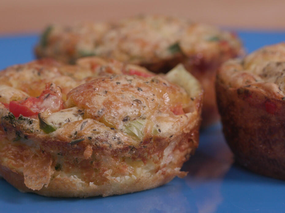 Veggie quiche muffins on a blue plate