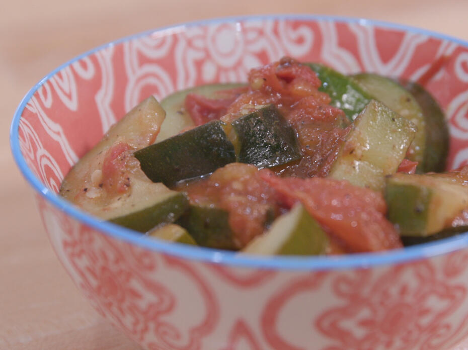 Zucchini and tomatoes in a colorful bowl