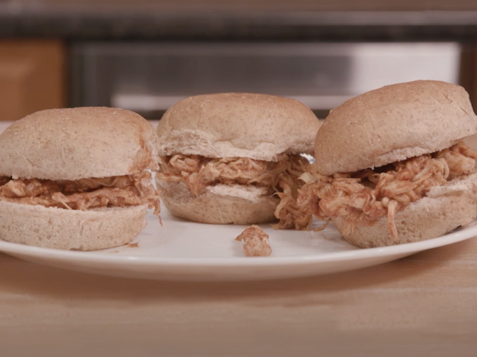 Barbecue sliders on a plate.