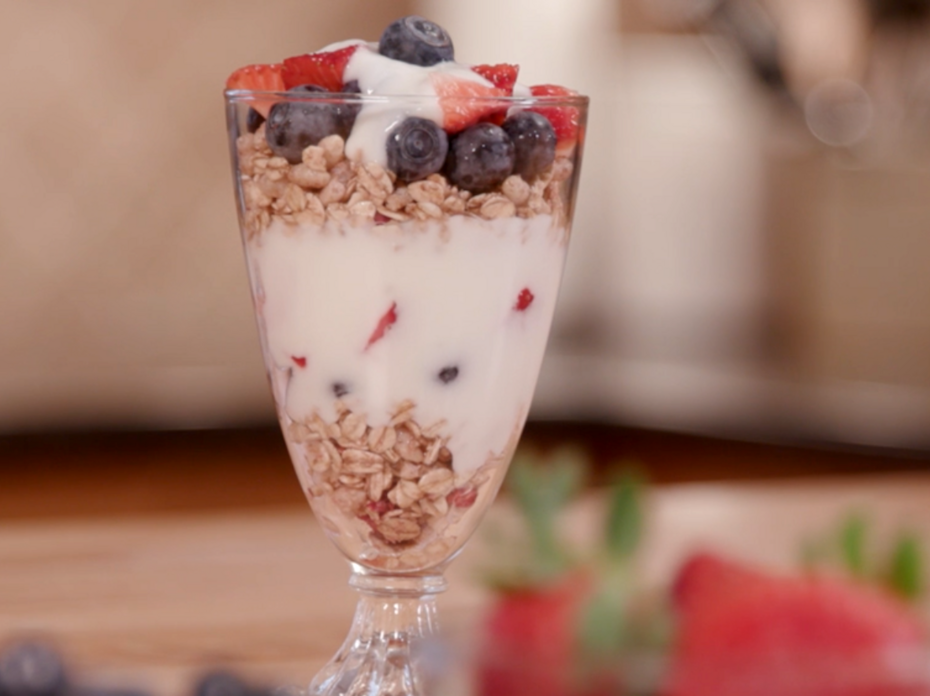 A parfait made of seasonal, locally grown blueberries, strawberries, granola, and yogurt.